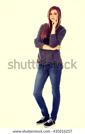 Teenage woman with folded hands 