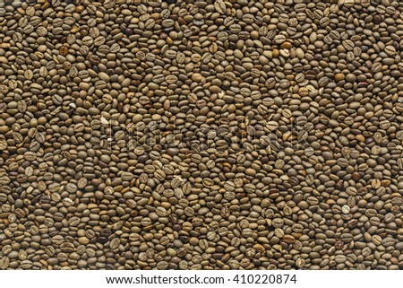 Heap of coffee seeds of different colors. Close up macro photography.
