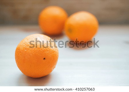 Orange isolated on wood texture with two oranges background