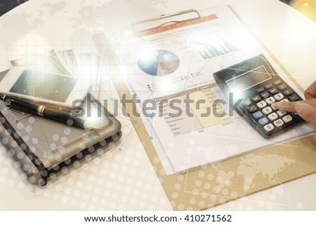 documents and business on office table with smart phone and laptop computer and graph business diagram