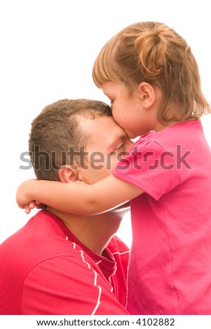 little, cute girl with pigtails giving a kiss to her father