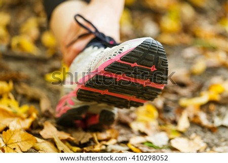 Close up photo of woman running shoe