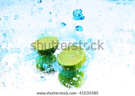 lime are dropped into blue water