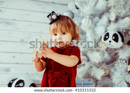 girl with Christmas toy in hands
