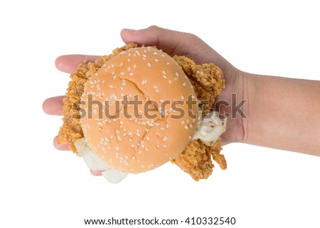 Hand holding a fried chicken burger isolate on white background