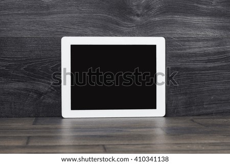 White Tablet. Tablet pc on wooden table