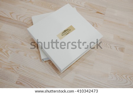 Wedding photo book and album on wooden background