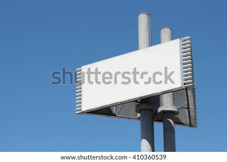 blank advertising pylon against blue sky