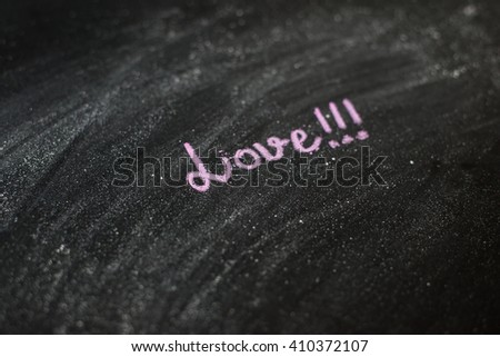 Handwritten message on a chalkboard: Love