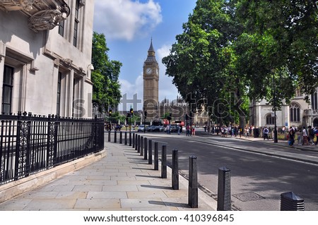 Quiet street in Westminster leading to the clock tower Big Ben. London, UK. Royalty-Free Stock Photo #410396845
