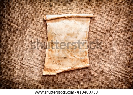 Old brown paper on a canvas background