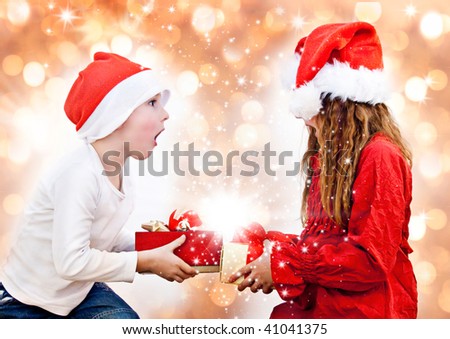 two sweet kids with christmas-presents