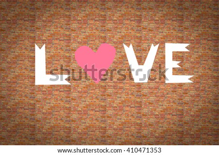 The word love written on the brick wall