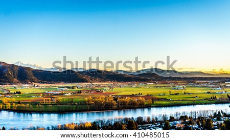 The fertile farmland of the Fraser Valley in British Columbia south of the Fraser River with Mount Baker in the distant background. Viewed from Mission Hill, north of the Fraser River Royalty-Free Stock Photo #410485015