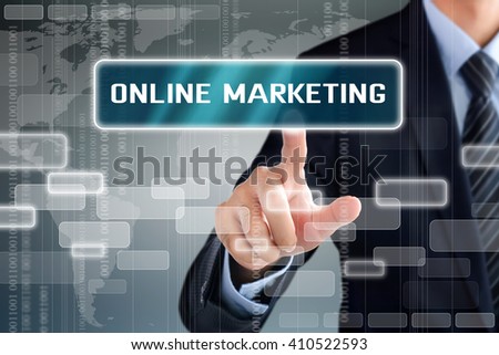 Businessman hand touching ONLINE MARKETING button on virtual screen