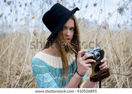  woman with an old camera, a favorite hobby for relaxation