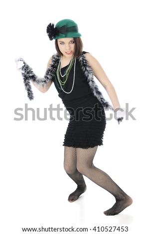 A beautiful teen "flapper" giving the view the eye as she dances in her fish-net stockinged feet.  On a white background.