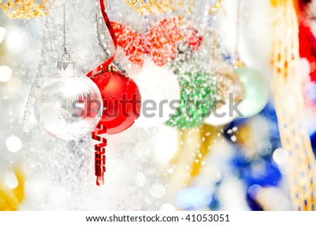 christmas decorations and snowflakes falling