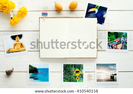Thai background. Memories of Thailand / travel planning. Tourist photos, marigold garland, exotic fruits, open notebook. 