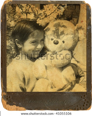 Old photo of a child with a toy bear. 1960-s XX Century, USSR.