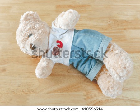 Teddy Bear on the wooden,at cafe background 