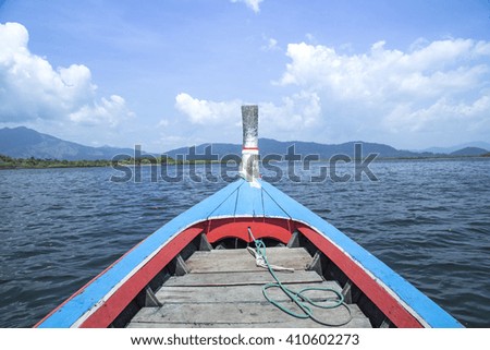 Traditional Thai wooden longtail boat in Andaman sea, Thailand