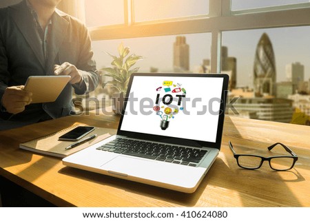 IOT INTERNET OF THINGS Thoughtful male person looking to the digital tablet screen, laptop screen,Silhouette and filter sun