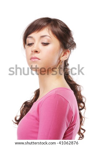 Haughty young brunette woman in pink against white background