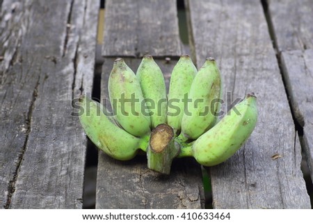 Banana, Thai cultivated banana, Thai bananas on wooden background.