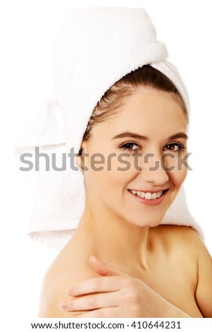 Young happy woman touching her face