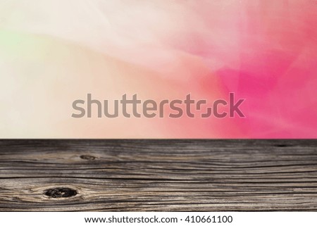 Empty top wooden table and floral blurred background