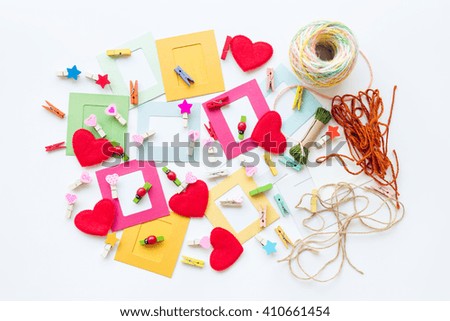 Paper photo frame with decoration over white table background