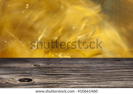 Empty top wooden table and floral blurred background