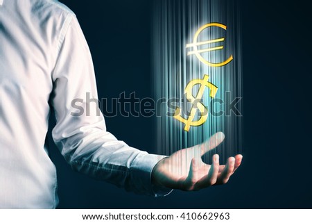 Businessman showing dollar and euro sign in his hand, on dark background