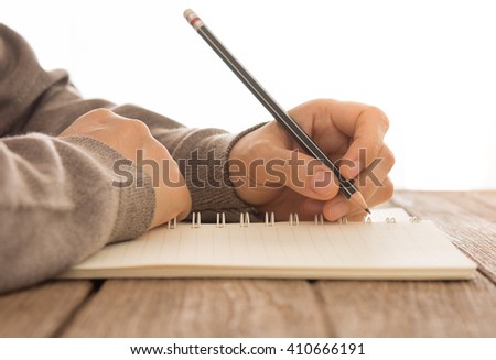 Human writing something on the diary. Writer concept.