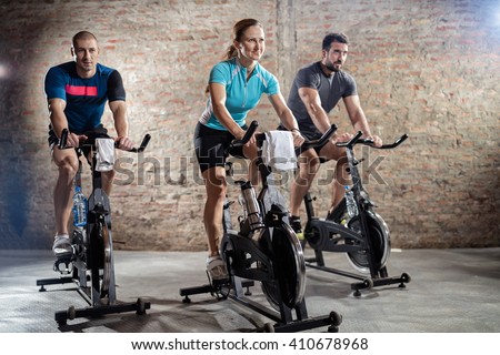 
Young people cycling workout with rhythm of powerful music Royalty-Free Stock Photo #410678968