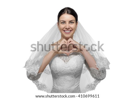 Beautiful bride with hands shaping a heart symbol. Isolated on white.