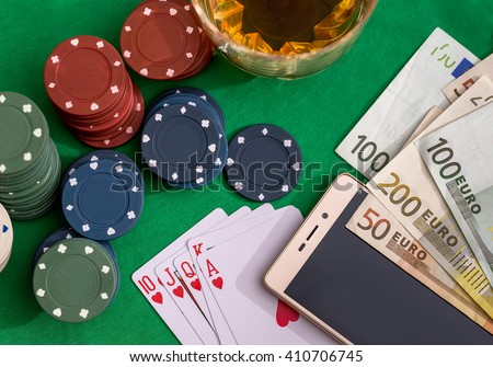 Poker chips, cards  and euro bills with cognac glass