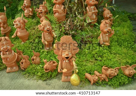 Red indian sculptures in ornament plants