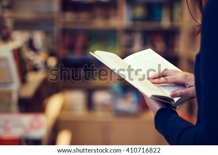 Reading a book Royalty-Free Stock Photo #410716822