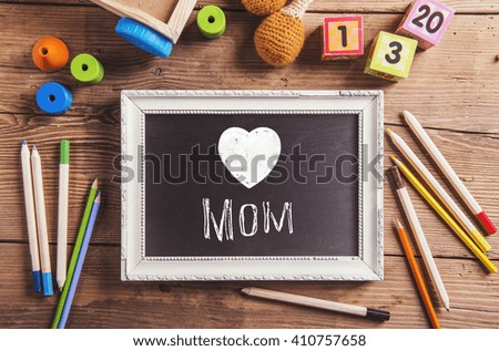 Mothers day composition, various toys. Picture frame, studio sho