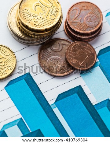 Graph Of Stock Market With Stacks Of Coins