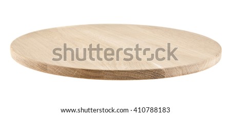 round cutting Board isolated on white background. Closeup Royalty-Free Stock Photo #410788183