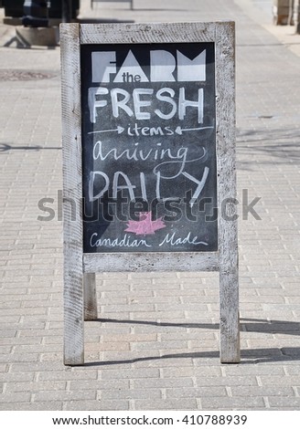 Farm fresh items arriving daily Canadian made sign