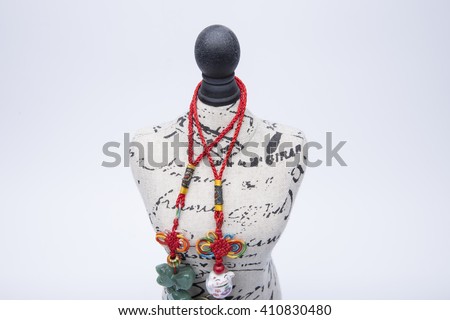 Fashion symbol, mini statuette mannequin with mysterious mystical beads