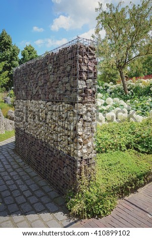 Three-tiered stone fence in the garden.