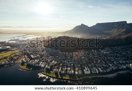 Birds eye view of city of cape town with buildings on water front on a bright sunny day. Aerial view of Cape Town city. Royalty-Free Stock Photo #410899645