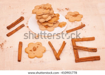 Wording herbs from cinnamon sticks and  cookies