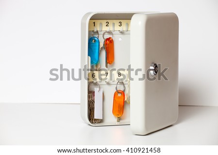 Metal box with keys . Colored tags of keys. Royalty-Free Stock Photo #410921458