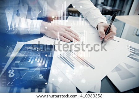 Banking manager working process.Concept photo trader work market report modern tablet.Using electronic device.Graphic icons,stock exchange reports screen interfaces.Business startup.Film effect